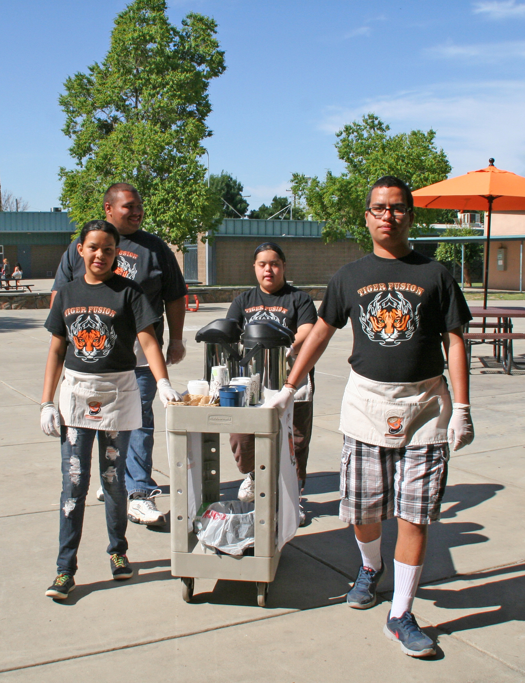 AcCEL students serving coffee