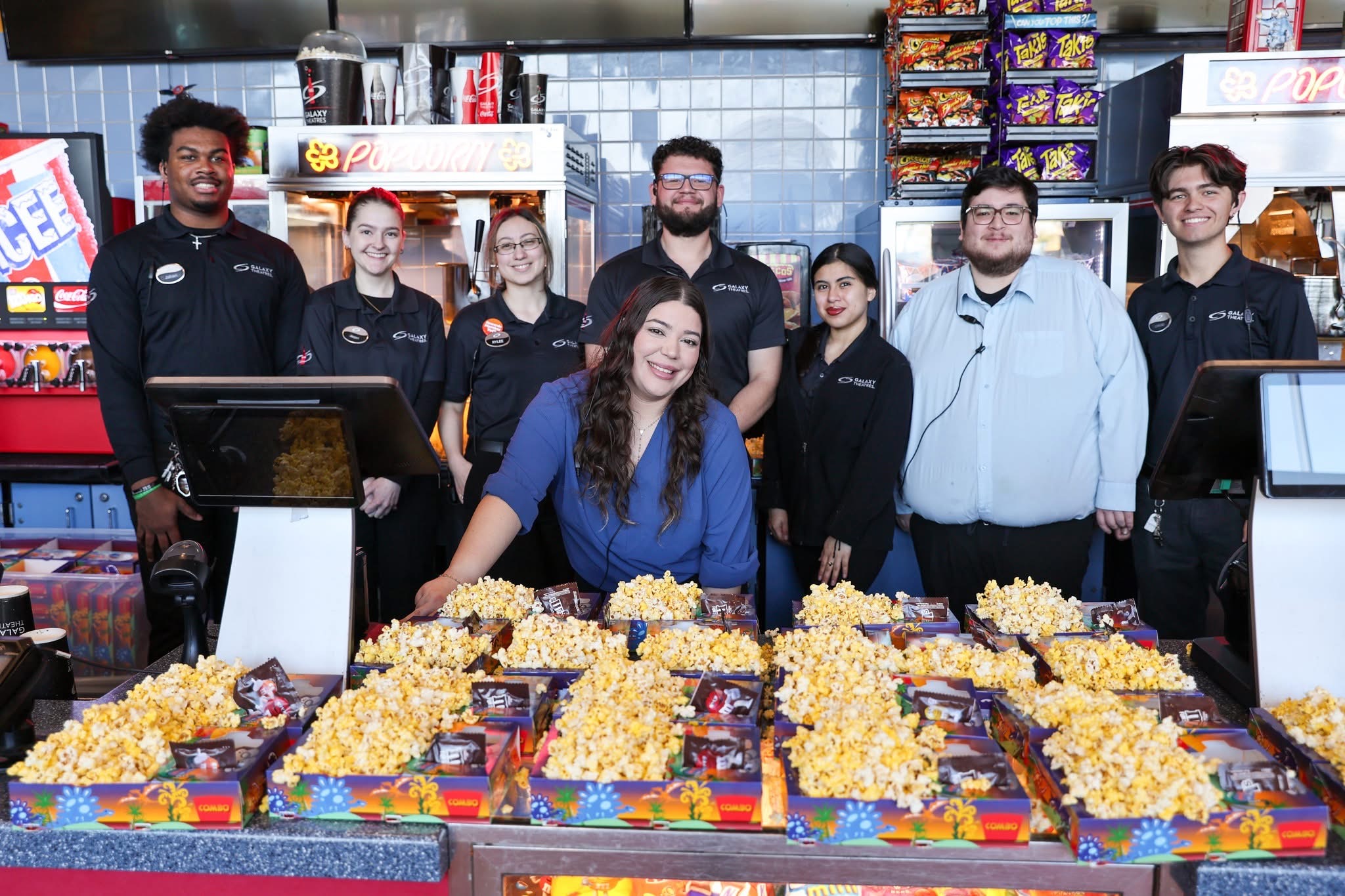 Galaxy Theatres staff with popcorn.