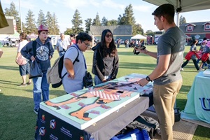 IMG_1757 Students at prevention booth at Red Ribbon event.
