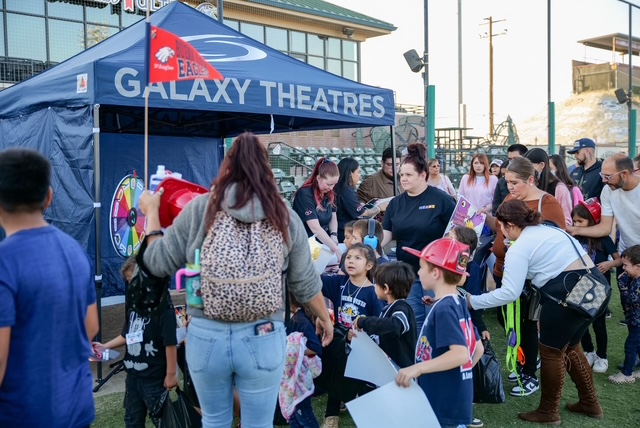 Students at popcorn booth at Red Ribbon event.