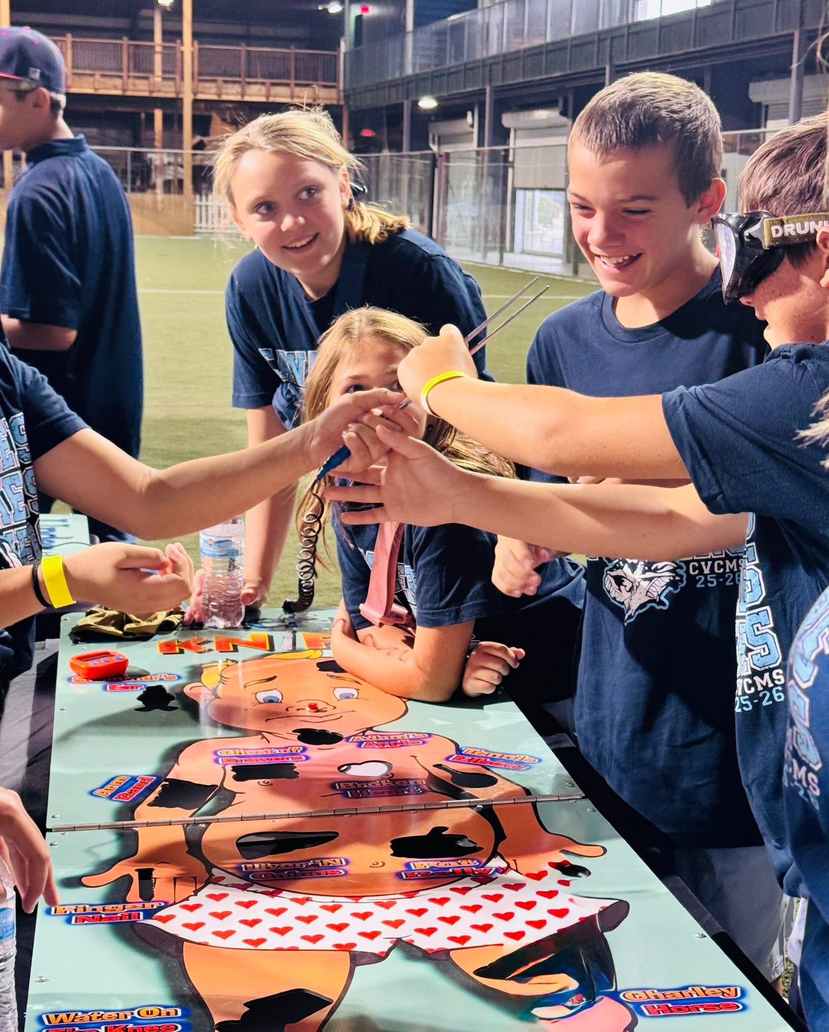 Students playing life size operation with and without cannabis goggles.
