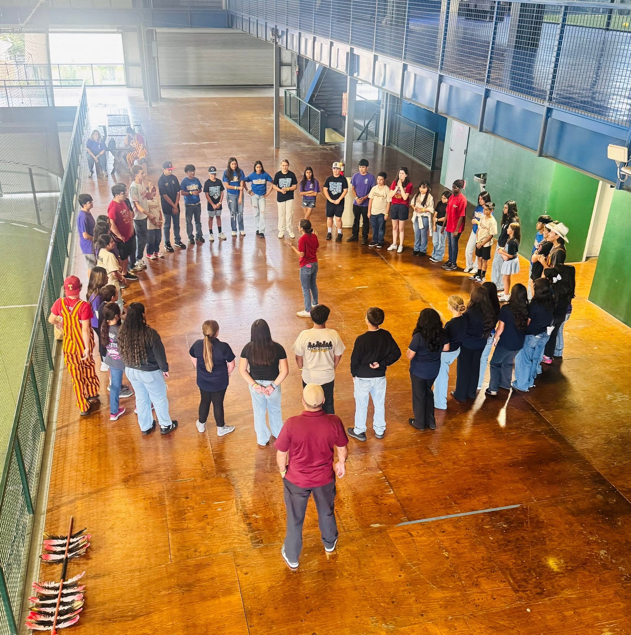 Students in a circle doing an activity with Tulare Union ASB.