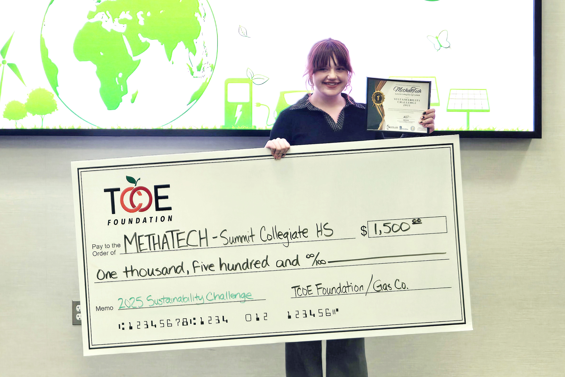 2025 Community Design Challenge 5 Winning presenter with check