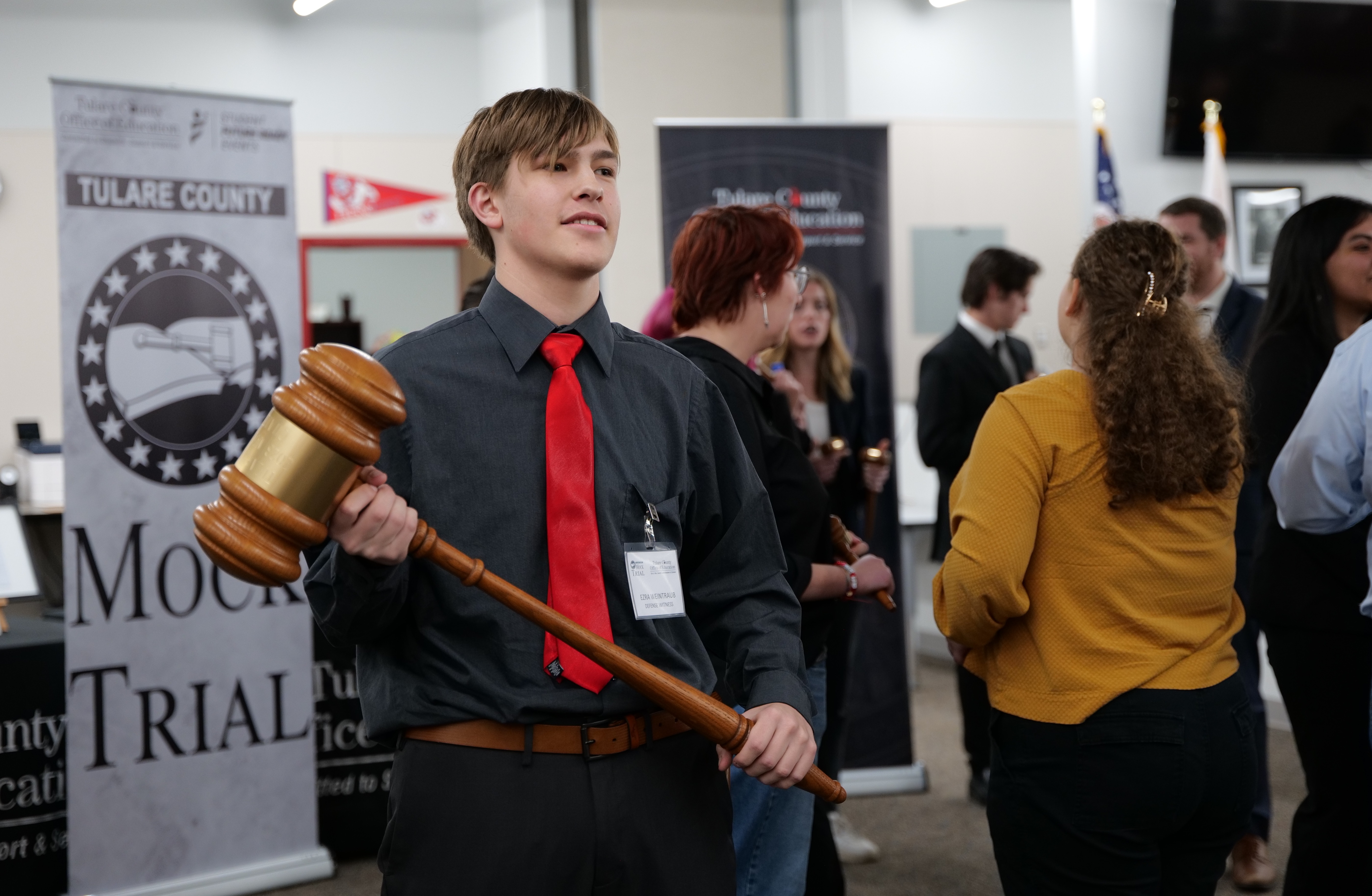Student holds gavel trophy