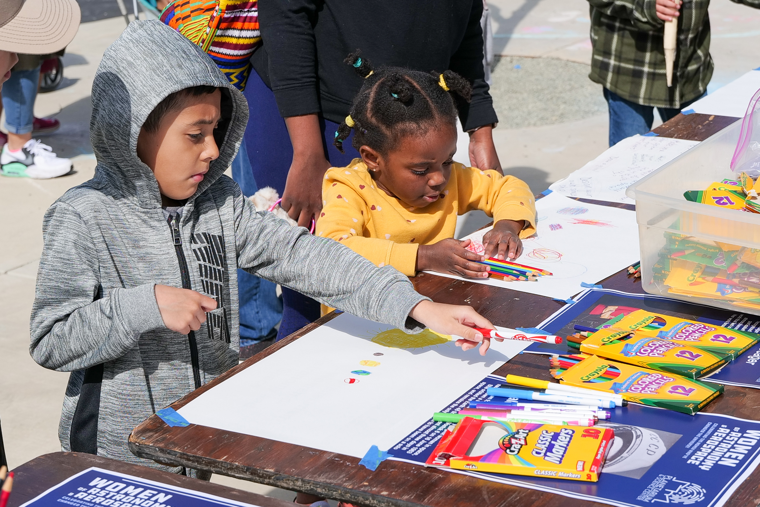 children at STEAM Expo table