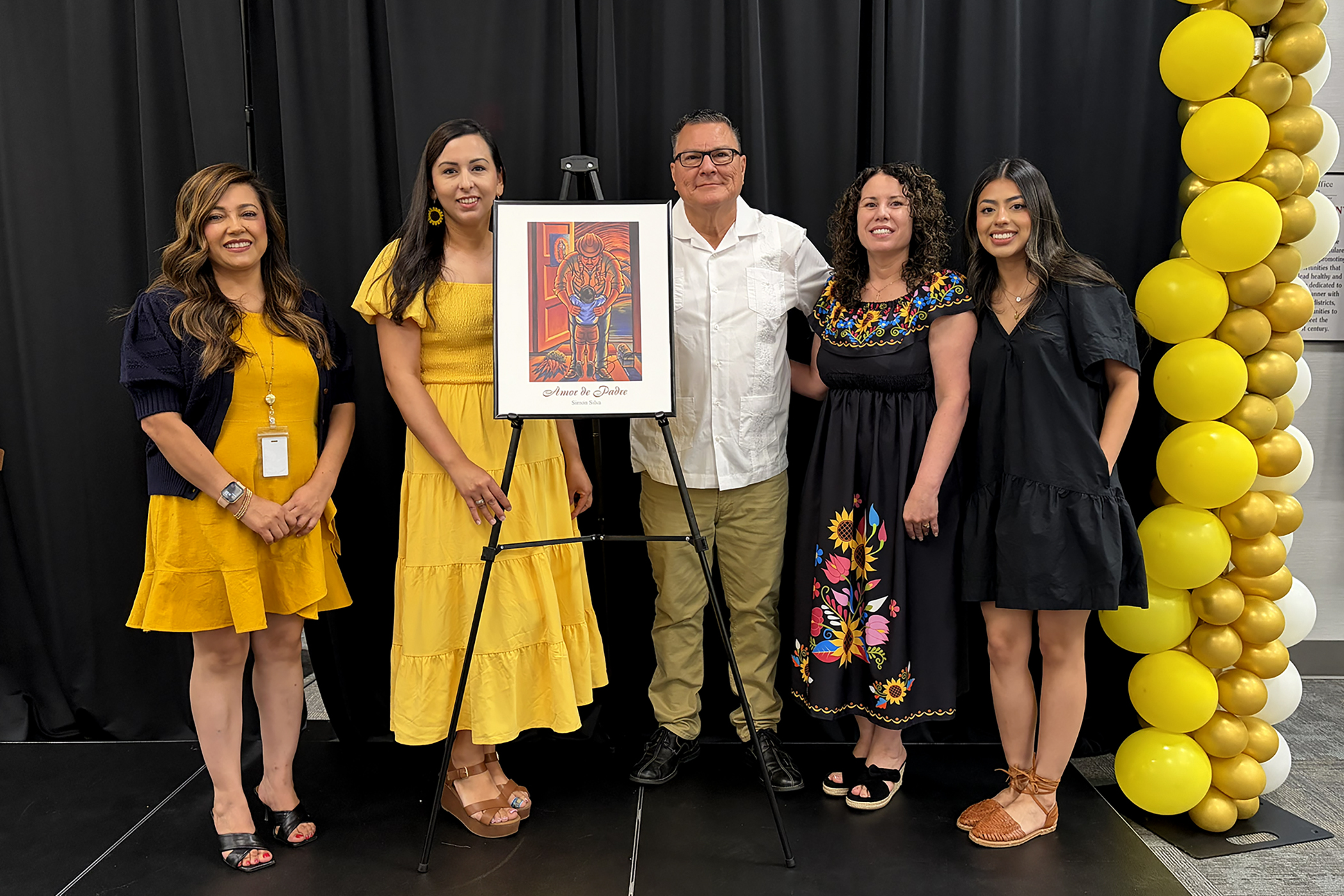 Staff with Simon Silva at Migrant Education Health & Education Fair