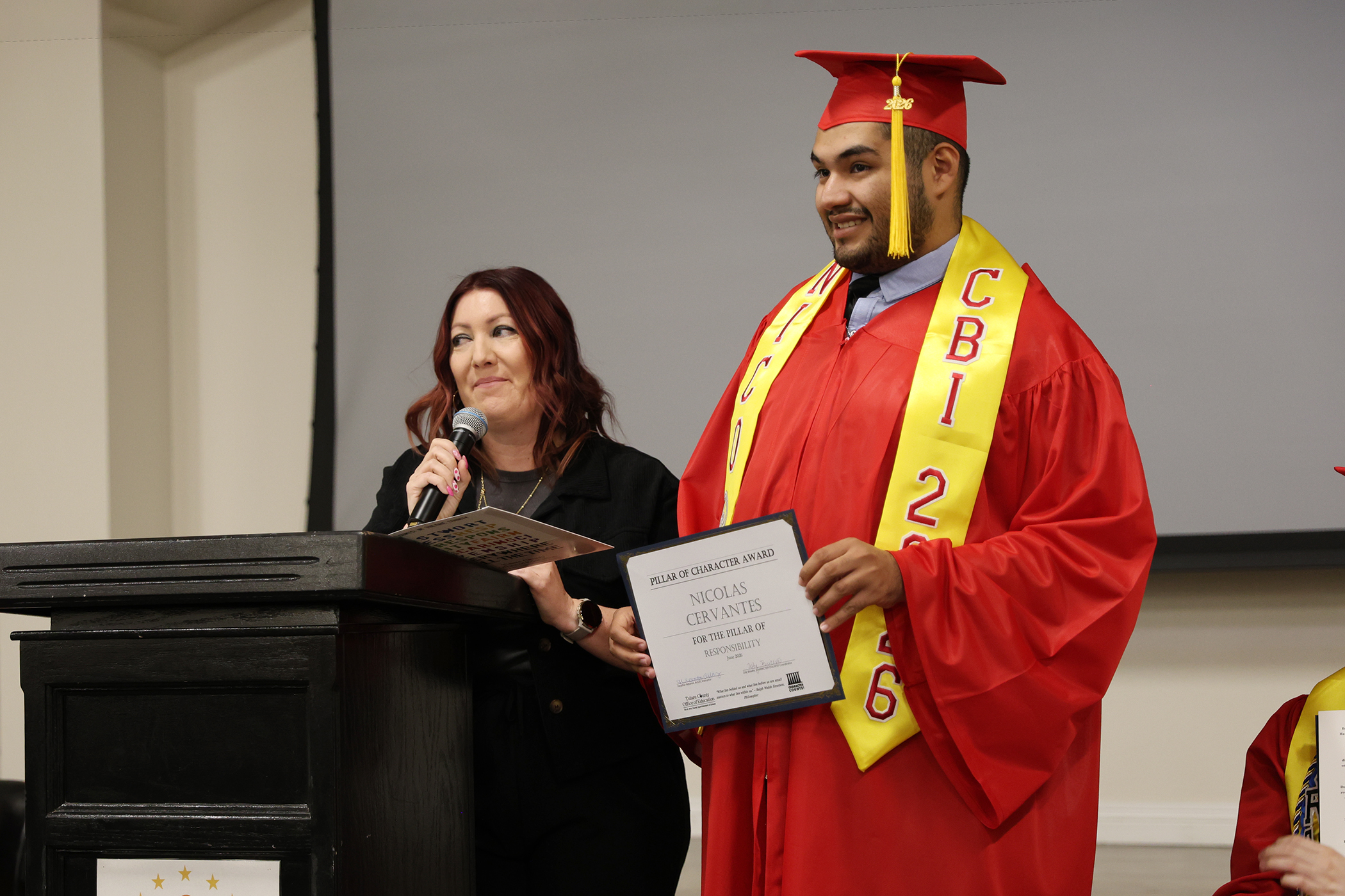 Student and teacher at 2026 Porterville AcCEL graduation