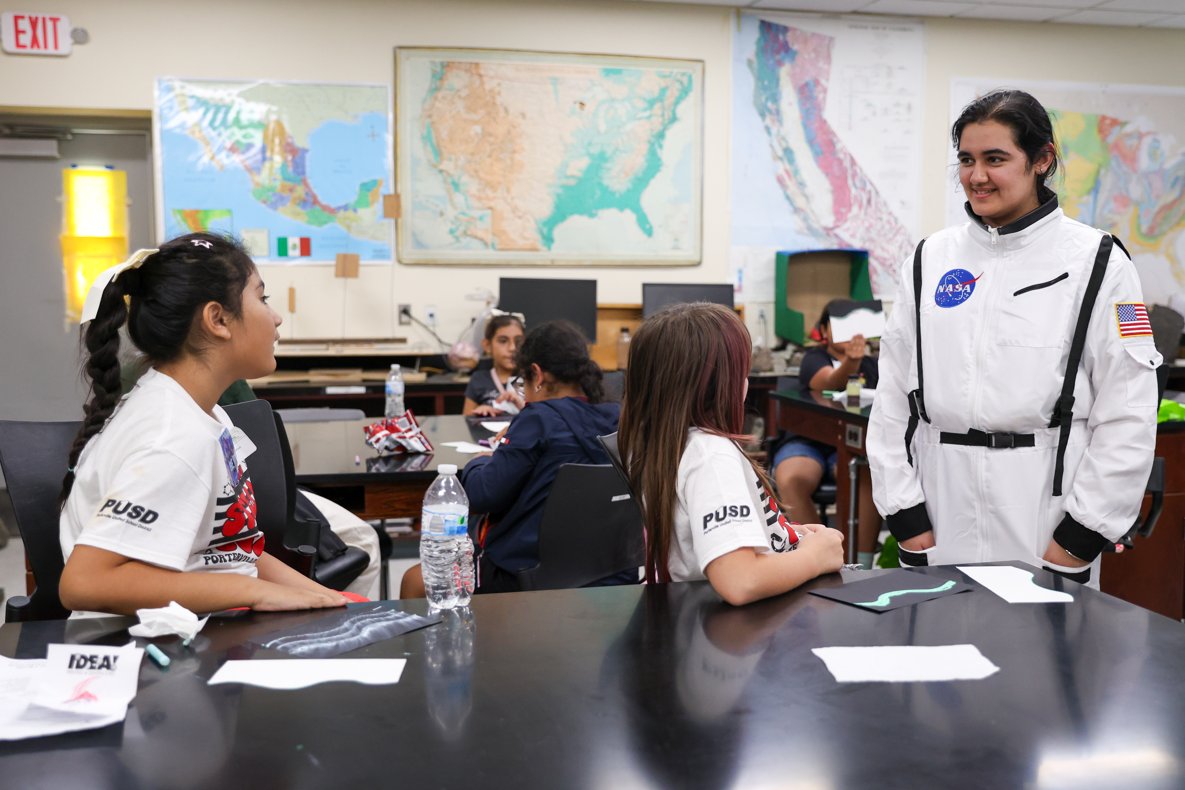 2025 EYH-38 Girls talk to woman in NASA spacesuit