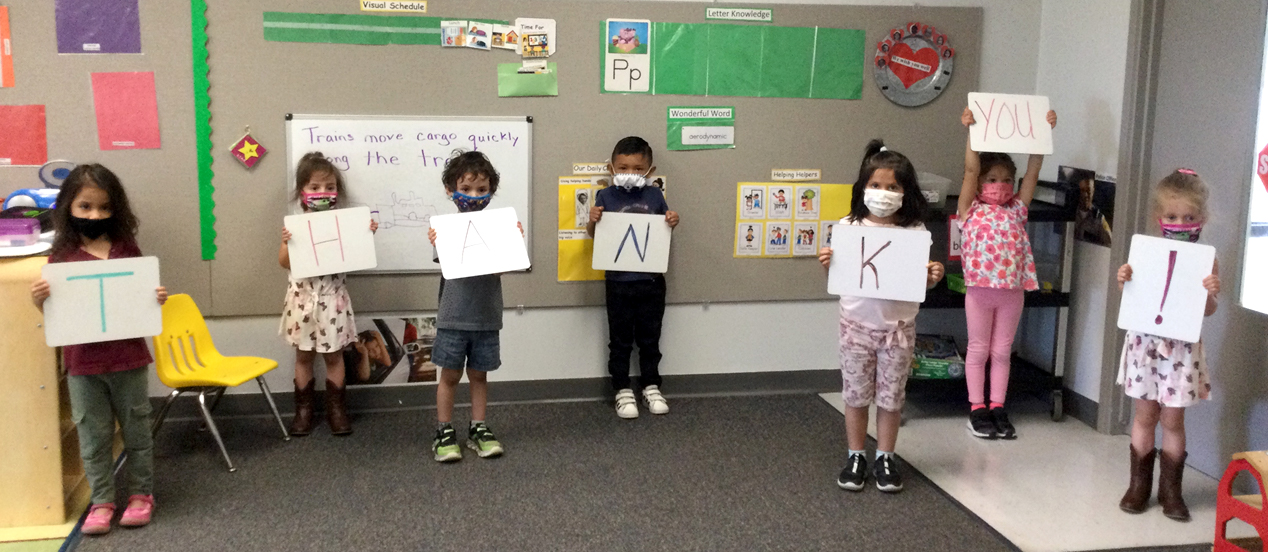 Students in mask hold up 