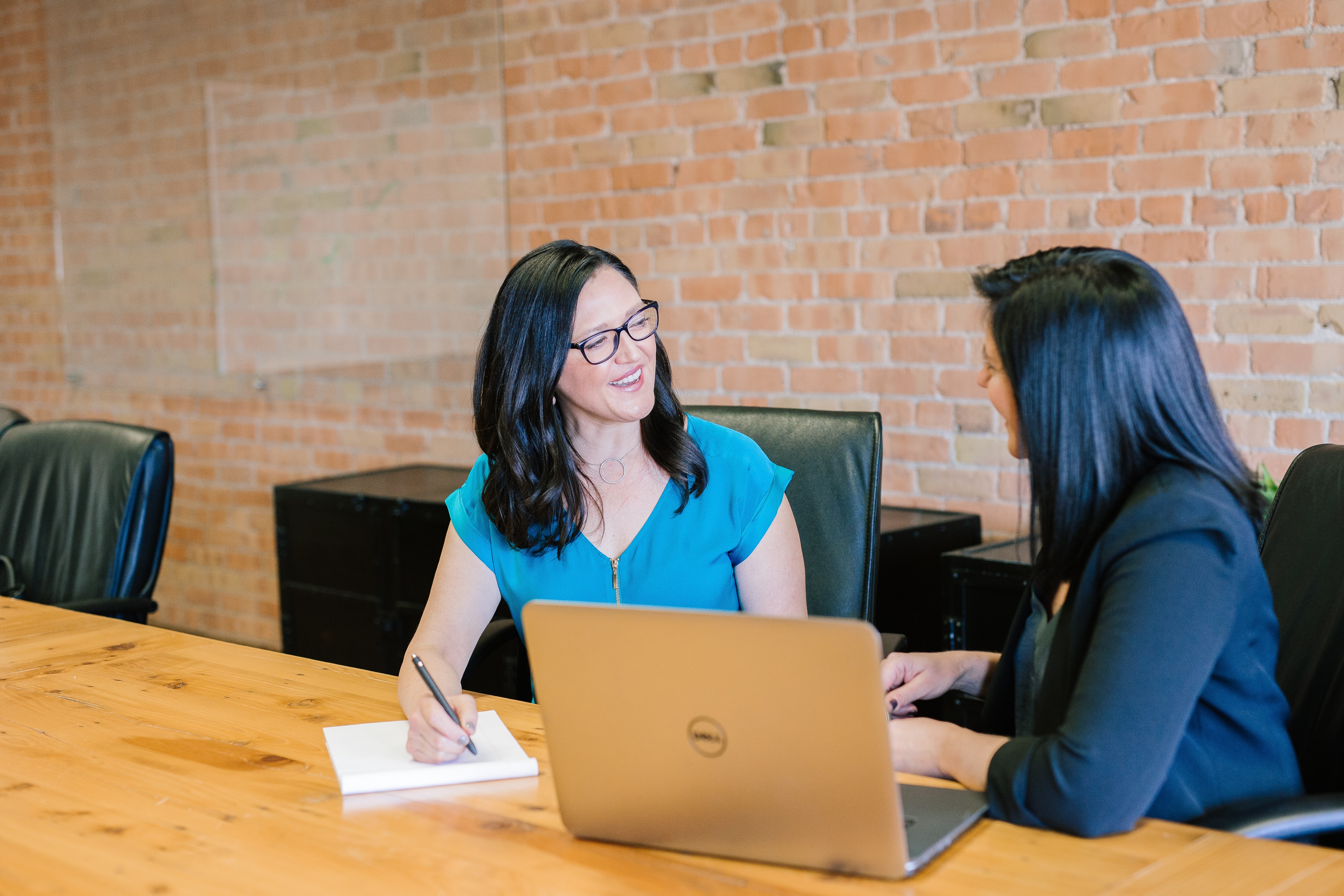 Two women engaged in a conversation.
